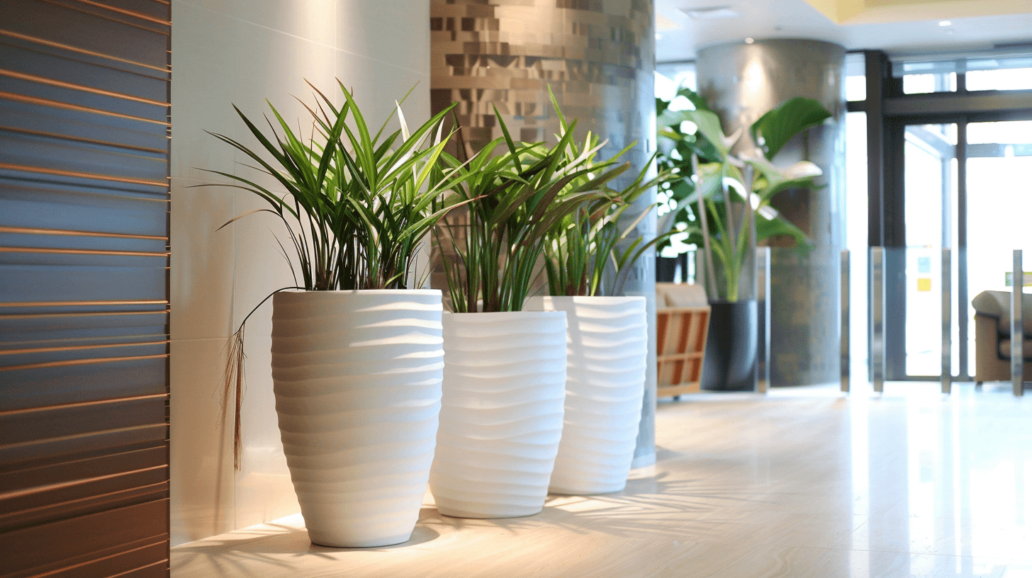 Modern Miami office lobby with ceramic ceramic pots housing vibrant green plants.