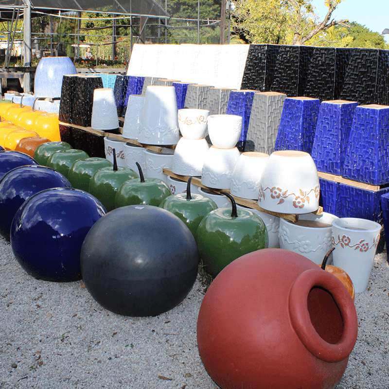 Colorful outdoor ceramic planter pots for sale in a Miami Garden Center